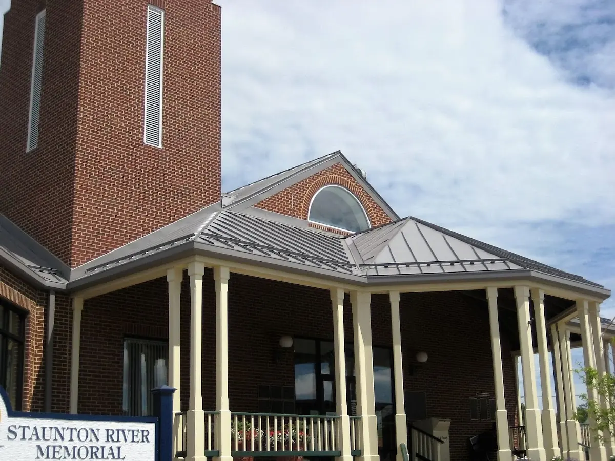 Skilled roofing craftsmen working on a residential roof in Roswell